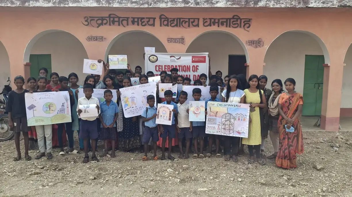 National Day celebration at Akrimat Madhya Vidyalaya Dhamnarioh — children displaying artwork - slide 1